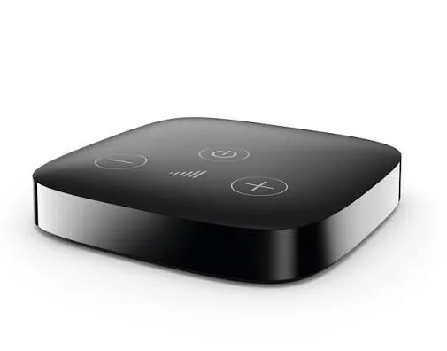 The Phonak TV Connector, a small black television streaming box