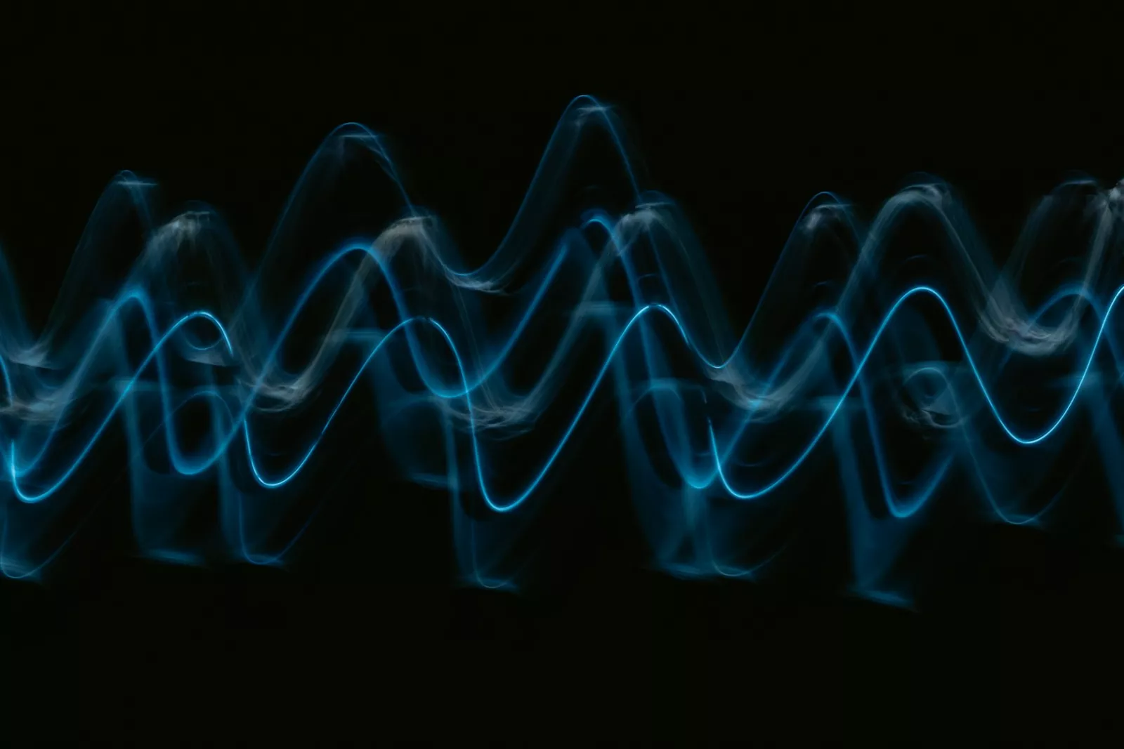 A sound wave, representing the frequencies measured during a hearing test